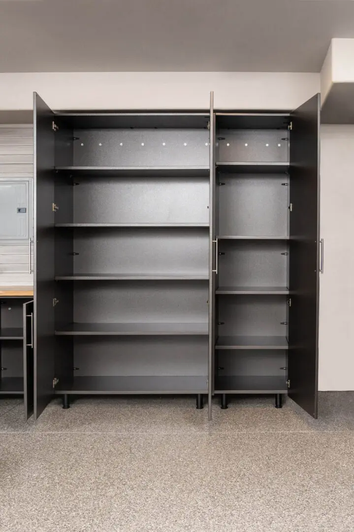 A metal cabinet with shelves and locking doors.