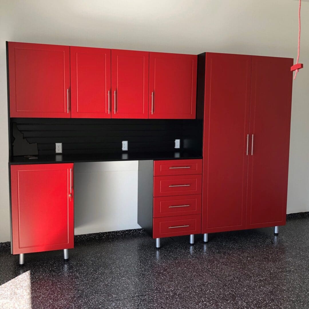 A red cabinet and sink in a room.